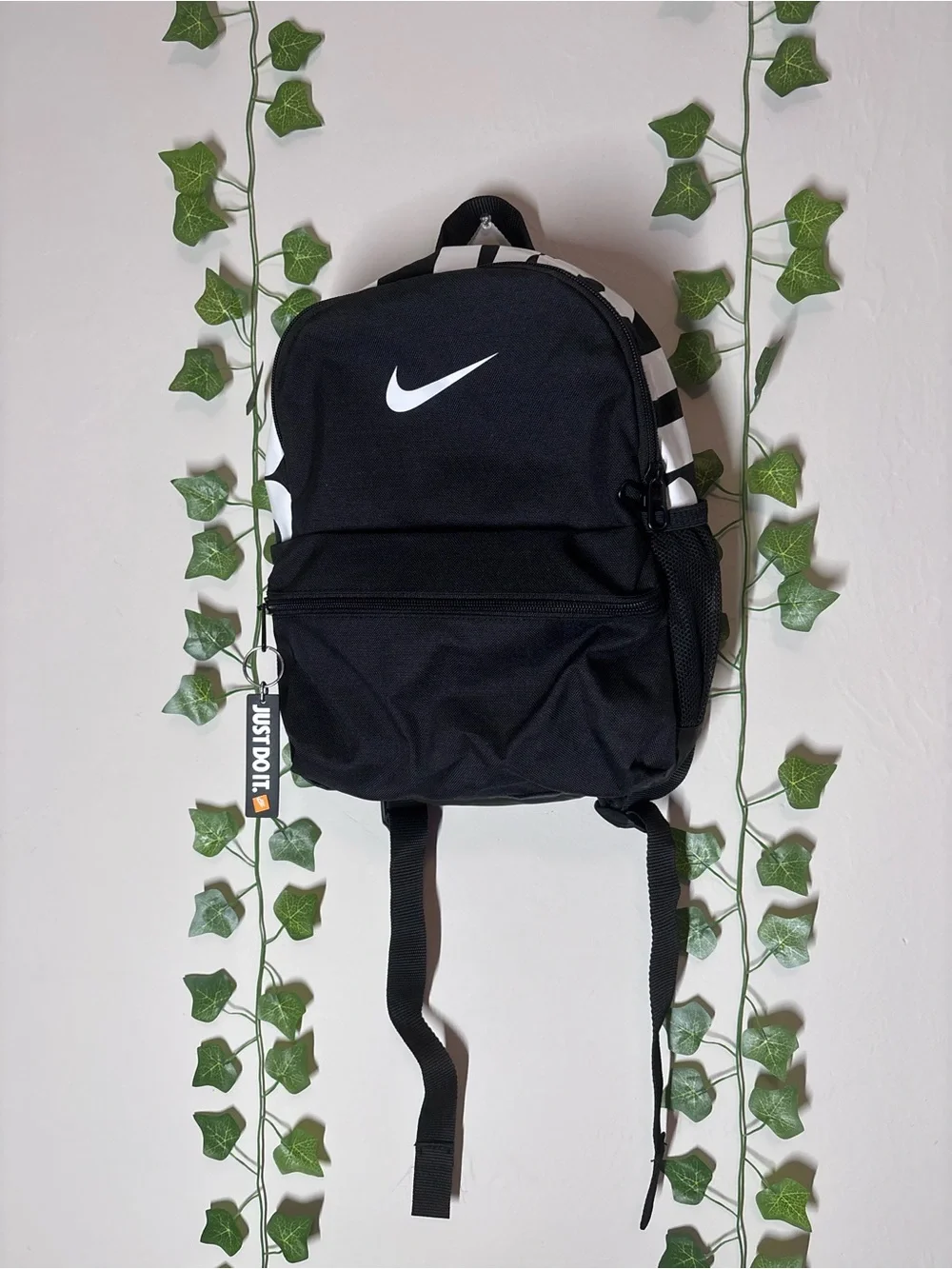 Nike Black Backpack with White Swoosh and Accent Stripes